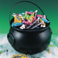 Black kettle with variety of art supplies