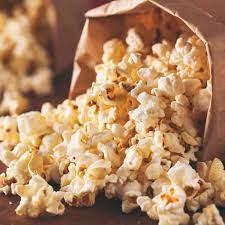 Is popcorn a healthy snack shows popcorn already popped in a paper bag