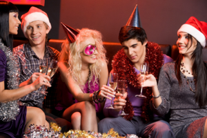 Holiday Gift Ideas Online a group of people enjoying a glass of cheer at a holiday party gathering
