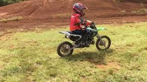 Kids Dirt Bikes with a youngster riding a 50-cc dirt bike