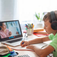 Brainfood Ambassador program wth home schooling with live teacher teach a young boy using a laptop,