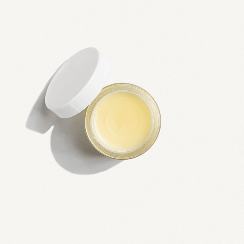 Pictured a white 2 oz jar of Miracle Skin Care Balm. Balm is a pale yellow color